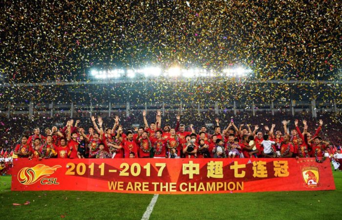 Guangzhou Evergrande players celebrate after winning the Chinese Super League (CSL)
